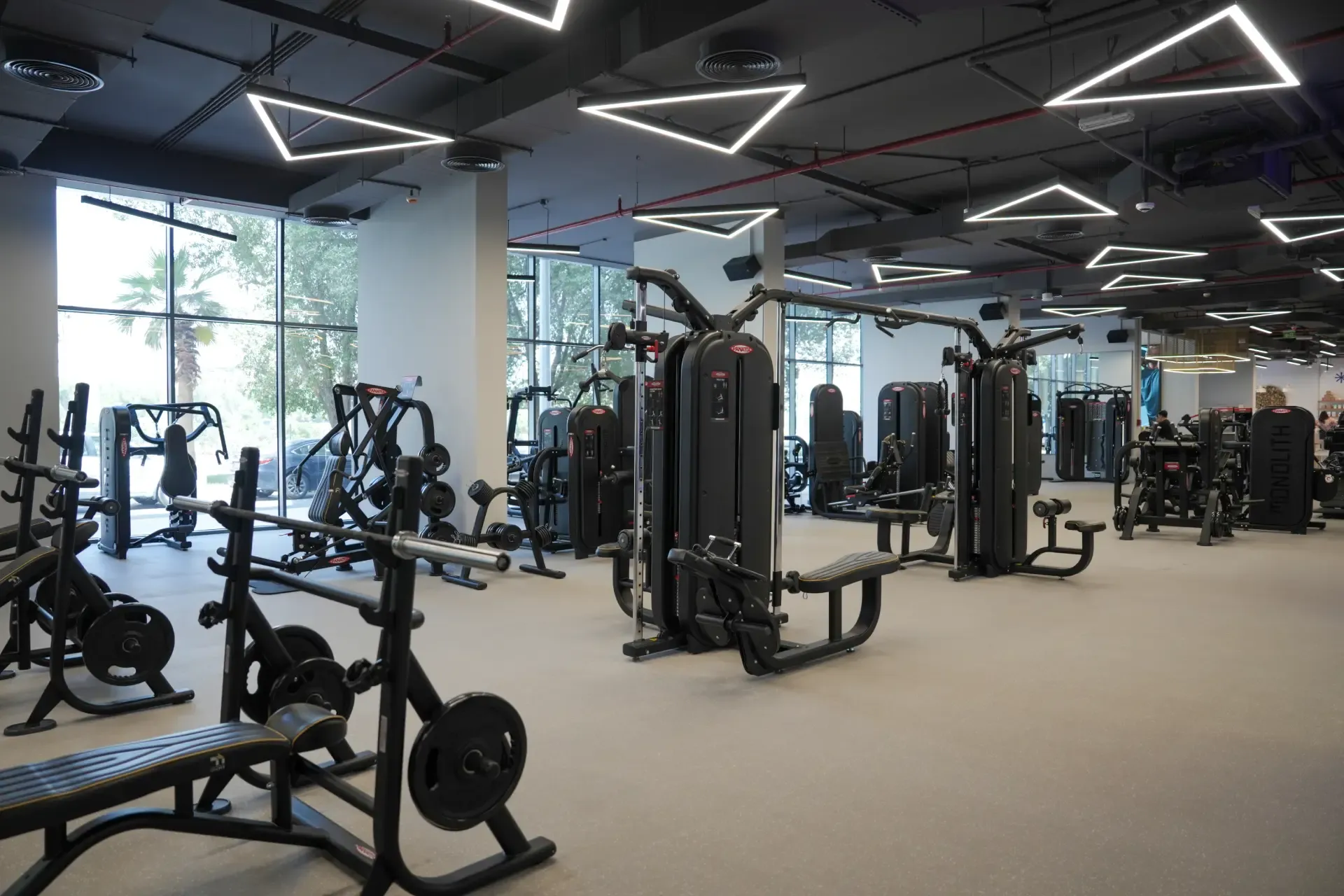 Fitness facility interior with equipment and architectural lighting